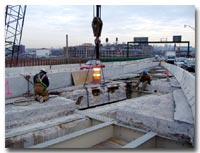 welders cutting steel beams photo